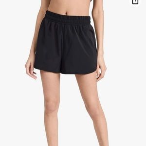 BEYOND YOGA IN STRIDE LINED SHORTS